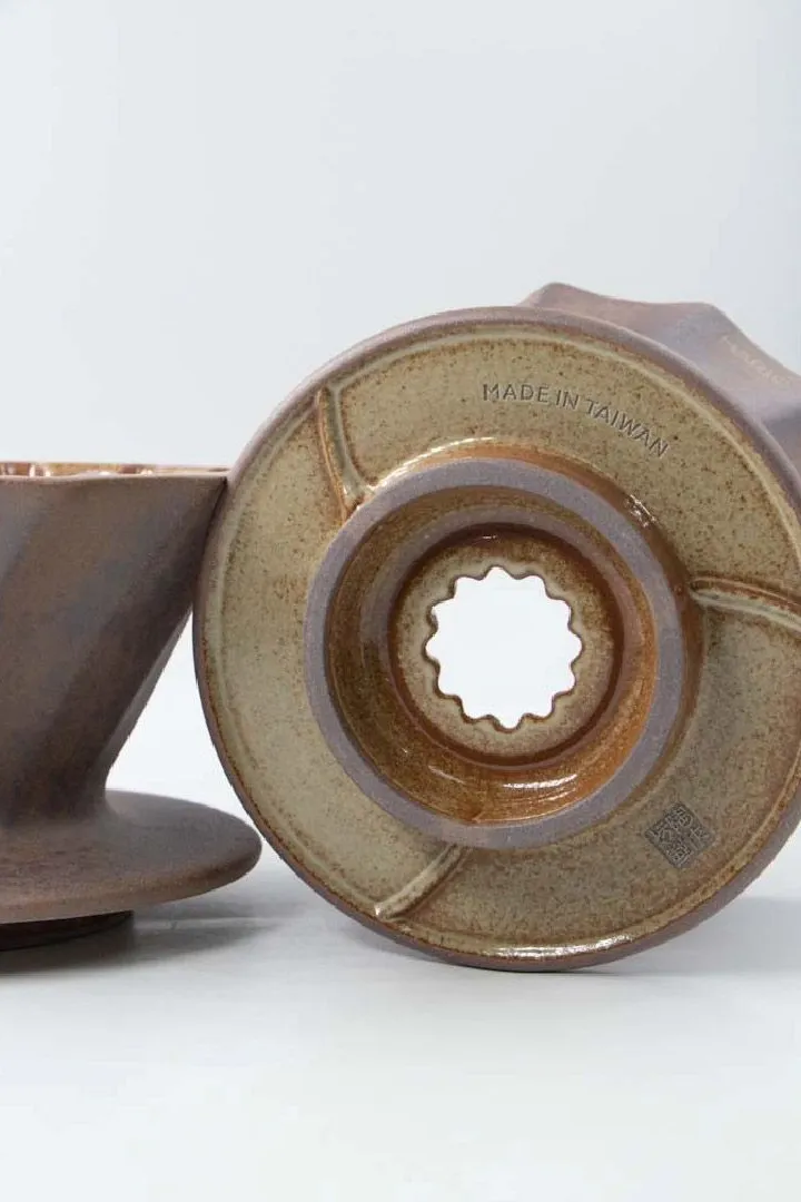 Close-up of the Alpha Lao Yan Ni dripper’s glazed base and single outlet