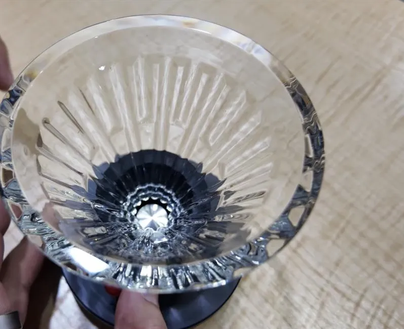 Looking down into the clear ribbed dripper seated on the Delta base