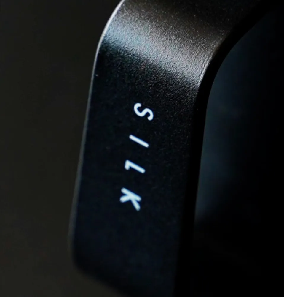 Black handle of the Nucleus Silk milk jug with SILK printed on it