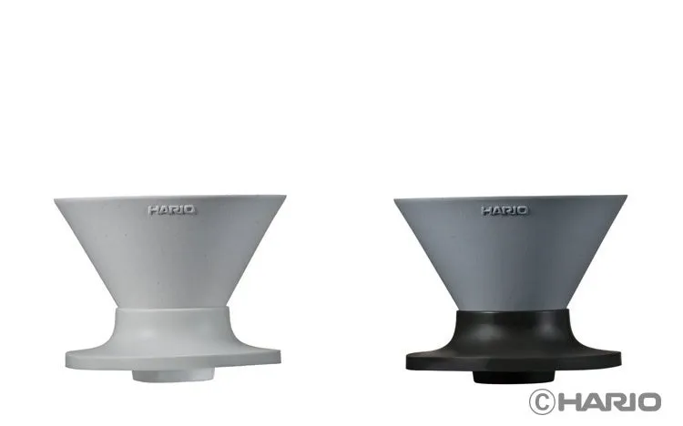 White and gray V60 NEO Ceramic drippers side by side, the gray one on a black base